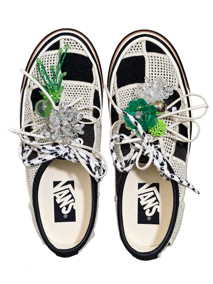 Checkerboard lace-up shoes with green and clear flower charms